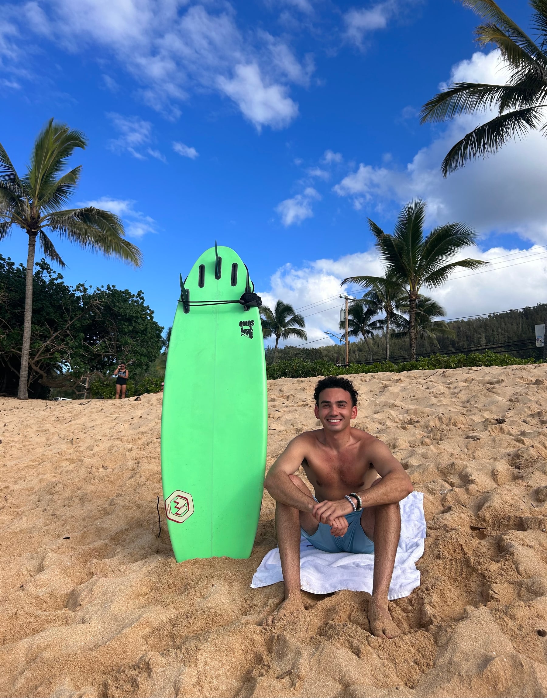 Stephen Leakos with a rescue board on the beach